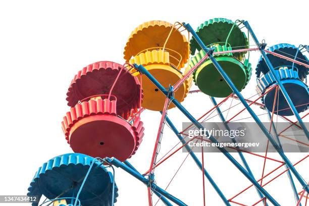 Colorful empty cabins of a Ferris wheel isolated on white