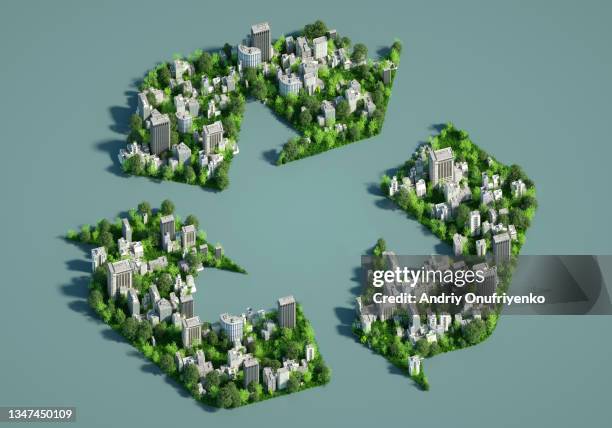 sustainable city in shape of recycle sign. - isometric city stock-fotos und bilder