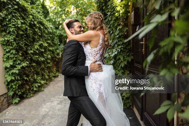 beautiful bride and groom on a wedding day - photo session stock pictures, royalty-free photos & images