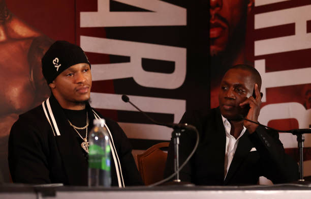 Tunde Ajayi , Trainer of Anthony Yarde and Anthony Yarde look on during the Lyndon Arthur v Anthony Yarde Press Conference at The Landmark Hotel on...