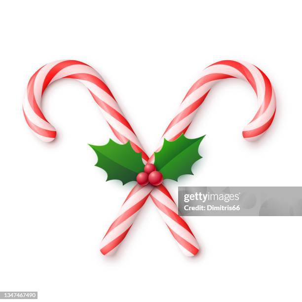 weihnachtsrealistisch kreuz und quer zuckerstangen mit stechpalmenbeeren und blättern auf weißem hintergrund - candy cane stock-grafiken, -clipart, -cartoons und -symbole