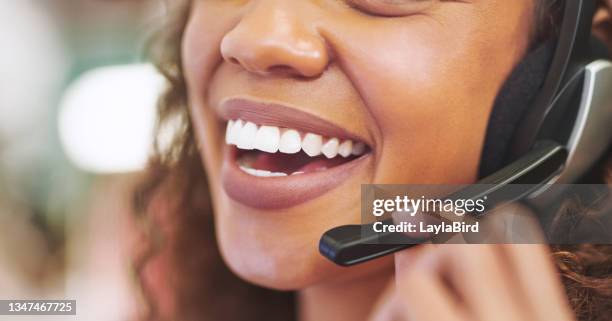 cropped shot of an unrecognizable businesswoman wearing a headset in the office during the day - human mouth stockfoto's en -beelden