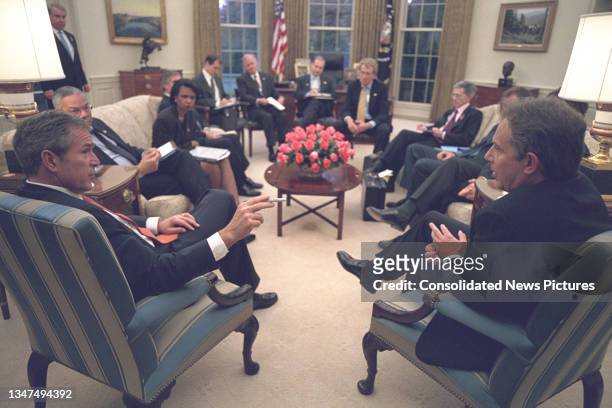 President George W Bush meets with British Prime Minister Tony Blair in the Oval Office of the White House, Washington DC, November 7, 2001. Among...