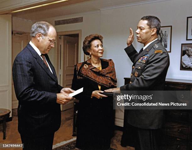 Secretary of Defense Dick Cheney administers the oath of office to General Colin L Powell as Joint Chiefs of Staff Chairman, Washington DC, October...