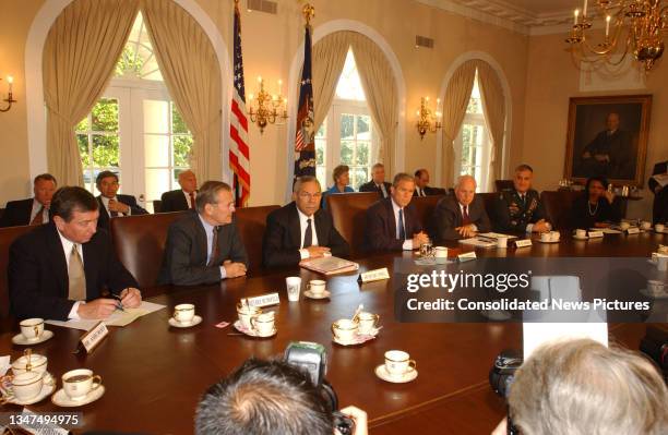 President George W Bush meets with national security advisors in the Cabinet Room of the White House, Washington DC, September 12, 2001. They were...