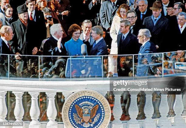 President Jimmy Carter takes the Oath of Office from Chief Justice of the US Warren E Burger on the East Front of the US Capitol, on Inauguration...