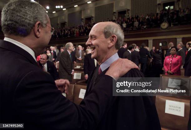 Secretary of State Colin L Powell greets US Supreme Court Associate Justice Stephen Breyer on the floor of the US House of Representatives,...