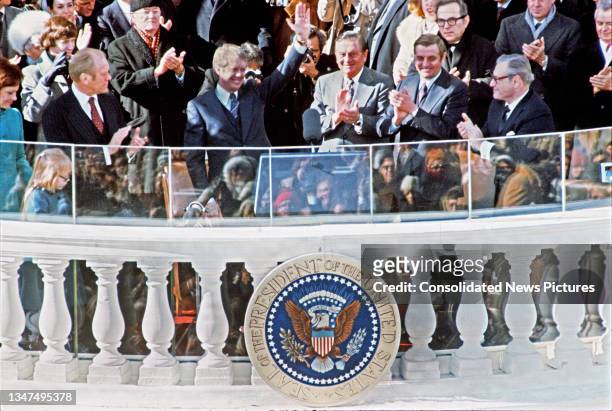 President Jimmy Carter waves following taking the Oath of Office on the East Front of the US Capitol on Inauguration Day, Washington DC, January 20,...