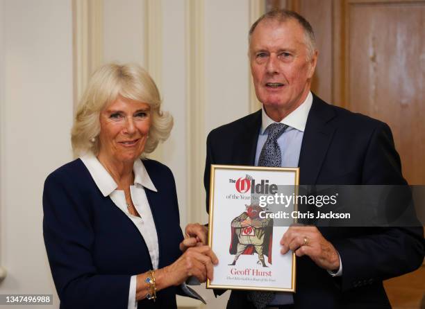 Camilla, Duchess of Cornwall presents Sir Geoff Hurst with the Oldie Golden Boot of the Year award at the Oldie Of The Year Awards 2021 at The Savoy...