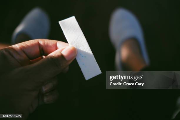 woman holds stick of gum - bubble gum finger stock pictures, royalty-free photos & images