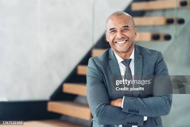 portrait of a smiling middle aged businessman - bald business man stock pictures, royalty-free photos & images