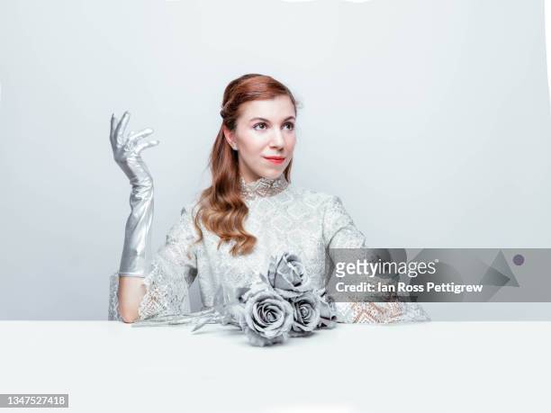 beautiful woman with silver rose - white glove fotografías e imágenes de stock