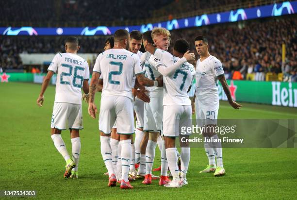 Cole Palmer of Manchester City celebrates after scoring their side's fourth goal with team mates during the UEFA Champions League group A match...
