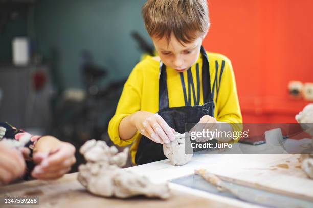 son and father pottering - pottery wheel stock pictures, royalty-free photos & images