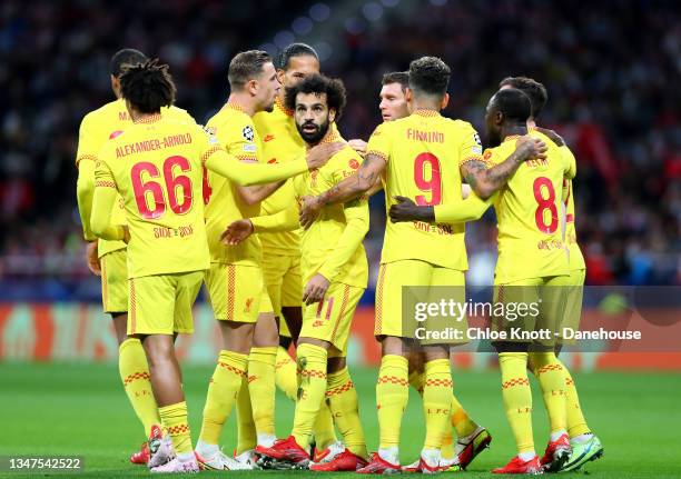 Mohamed Salah of Liverpool celebrates scoring his teams first goal during the UEFA Champions League group B match between Atletico Madrid and...