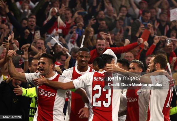 Players of Ajax celebrate their side's first goal, an own goal by Marco Reus of Borussia Dortmund during the UEFA Champions League group C match...