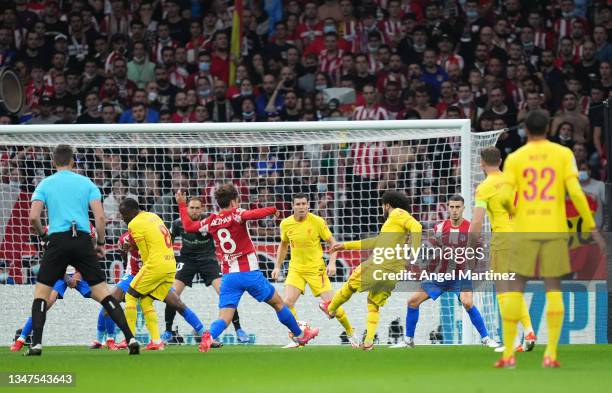 Mohamed Salah of Liverpool scores their side's first goal during the UEFA Champions League group B match between Atletico Madrid and Liverpool FC at...