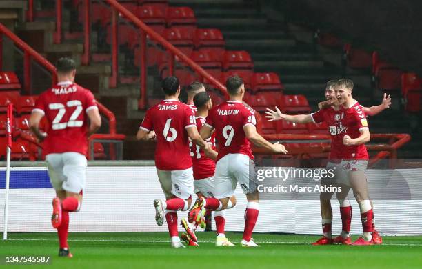 Alex Scott of Bristol City celebrates after scoring their side's first goal with team mates during the Sky Bet Championship match between Bristol...