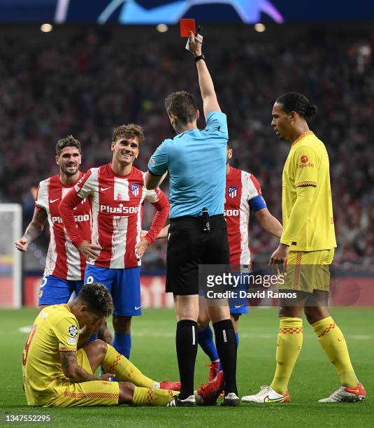 Antoine Griezmann of Atletico Madrid reacts as he is shown a red card by Match Referee, Daniel Siebert during the UEFA Champions League group B match...