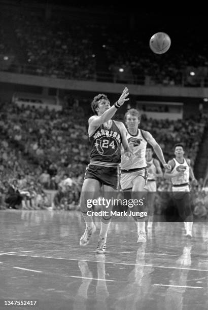 Golden State Warriors forward Rick Barry races downcourt in an attempt to catch a long pass during an NBA basketball game against the Denver Nuggets...