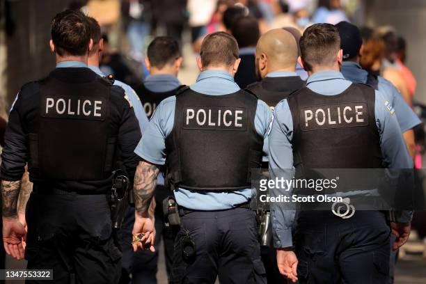 Chicago police officers patrol downtown as the city celebrates the Chicago Sky's WNBA title on October 19, 2021 in Chicago, Illinois. The city has...