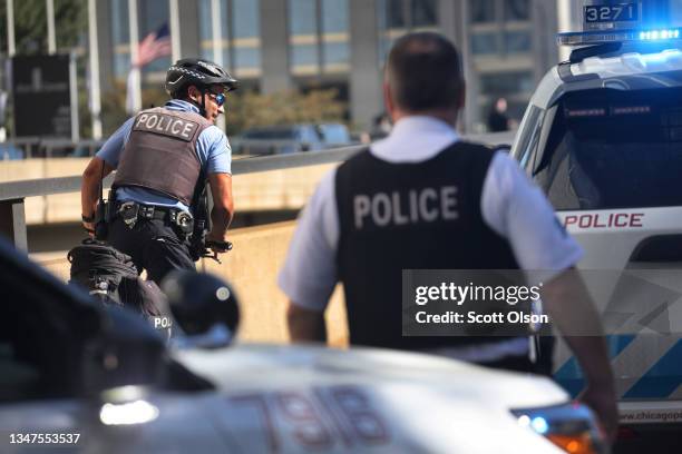 Chicago police officers patrol downtown as the city celebrates the Chicago Sky's WNBA title on October 19, 2021 in Chicago, Illinois. The city has...