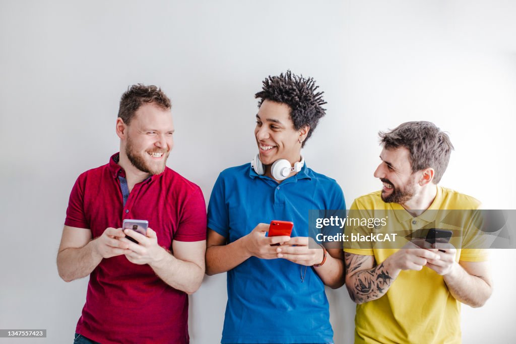 Multi-ethnic group of people uses technology