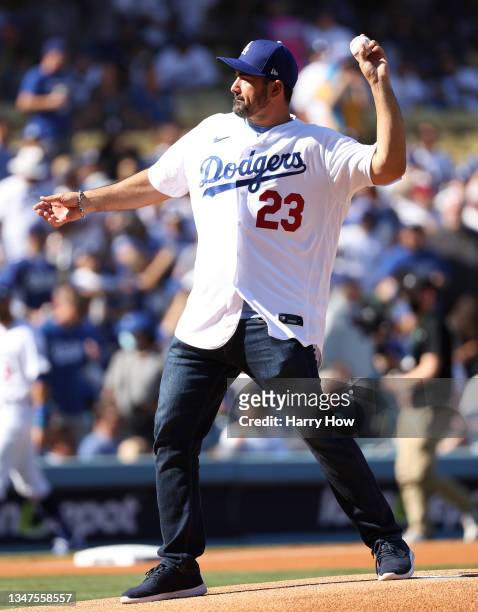 Former player Adrian Gonzalez throws out the ceremonial first pitch prior to the National League Championship Series between the Atlanta Braves and...