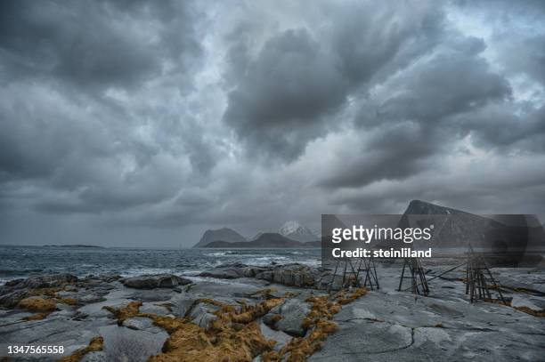 autumn storm over coastal landscape, lofoten, nordland, norway - extreme weather norway stock pictures, royalty-free photos & images