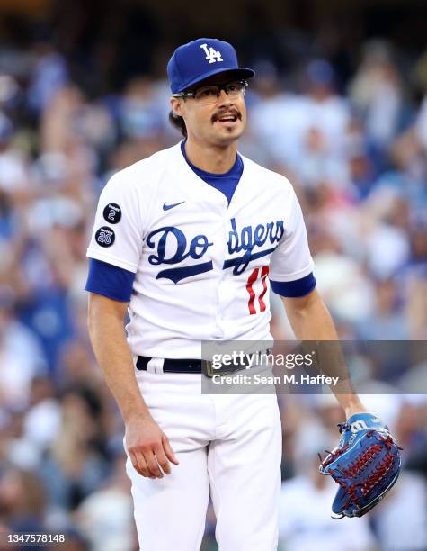 Pitcher Joe Kelly of the Los Angeles Dodgers reacts during the 6th inning of Game 3 of the National League Championship Series against the Atlanta...