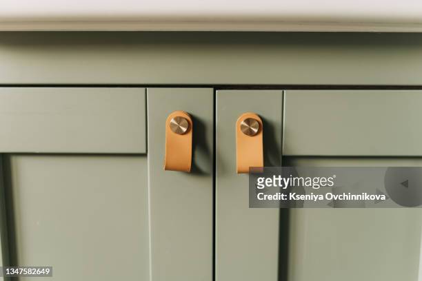 green facade of the kitchen close up. background of turquoise wooden decorative item. - armário de cozinha imagens e fotografias de stock