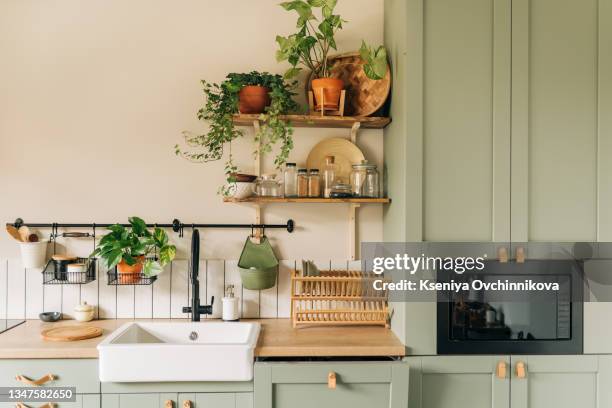 stylish interior of modern kitchen - grey colour stockfoto's en -beelden