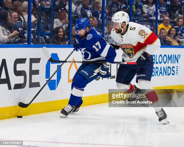 Alex Killorn of the Tampa Bay Lightning skates against Aaron Ekblad of the Florida Panthers during the first period at Amalie Arena on October 19,...