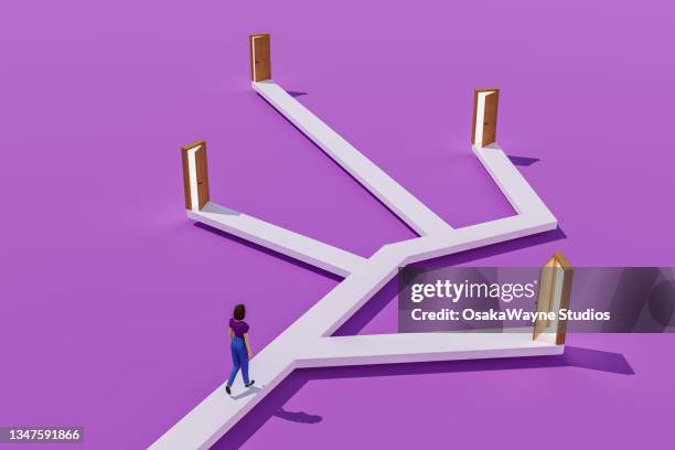 woman walking on branching way leading to multiple doors, choice and decision - options ストックフォトと画像