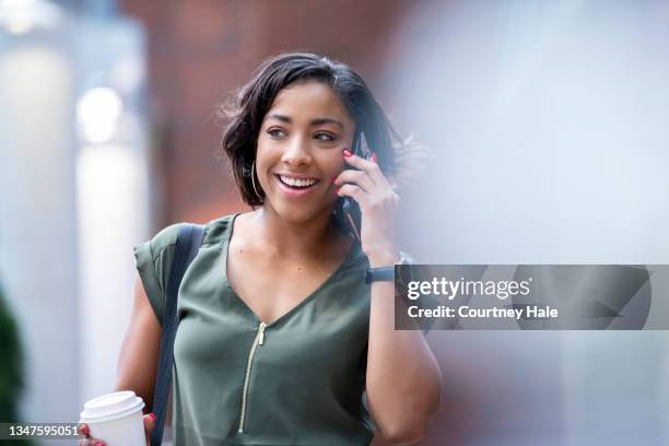 happy young businesswoman using smart phone and buying coffee during break in city - smart casual lunch stock pictures, royalty-free photos & images