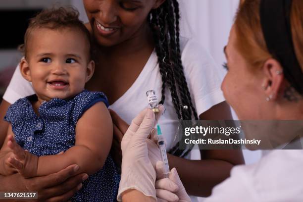 baby vaccination. - baby vaccination stock pictures, royalty-free photos & images