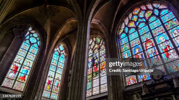 stained glass windows at cathedral of st. michael and st. gudula in brussels - cathedral of st michael and st gudula stock pictures, royalty-free photos & images