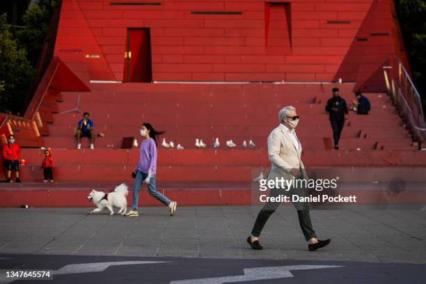 People are seen exercising in Southbank on October 20, 2021 in Melbourne, Australia. Lockdown restrictions will lift in Melbourne from Friday 22...