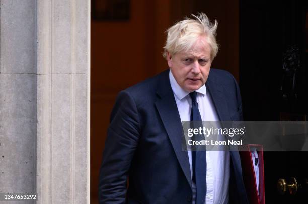 Prime Minister Boris Johnson leaves number 10, Downing Street as he heads to the weekly PMQ session in the House of Commons on October 20, 2021 in...