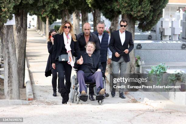 Ramiro Oliveros and his daughter Iris Oliveros Marquez after the burial of the singer in the cemetery of San Isidro, on October 20 in Madrid, Spain.