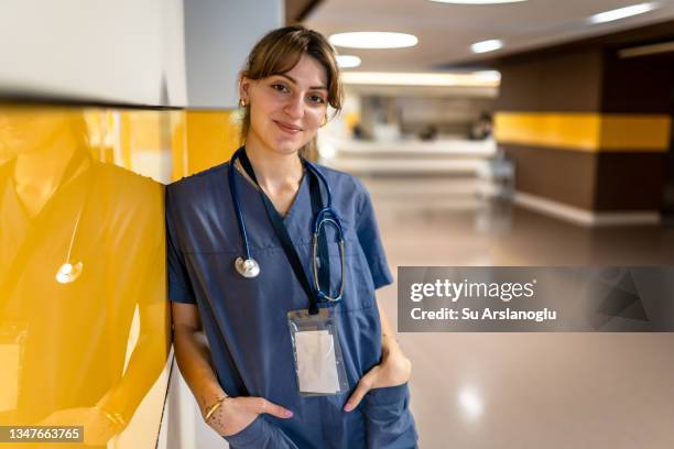 portrait of young female nurse in hospital - female nurse stock pictures, royalty-free photos & images
