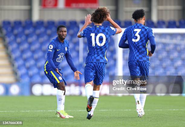 Dion Rankine of Chelsea celebrates with teammate Charlie Webster after scoring their team's first goal during the UEFA Youth League match between FC...