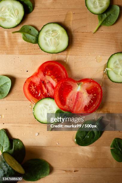 high angle view of vegetables on table - cucumber photos et images de collection