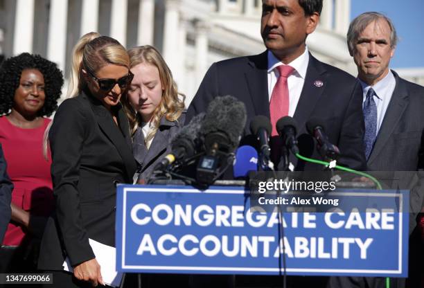 Actress and model Paris Hilton shares a moment with 12-year-old child abuse survivor Uvea Spezza-Lopin of Junction City, Oregon, as U.S. Rep. Ro...