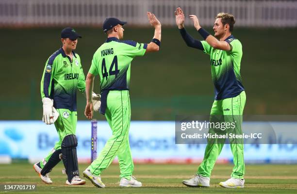 Mark Adair of Ireland celebrates the wicket of Wanindu Hasaranga of Sri Lanka with team mate Craig Young during the ICC Men's T20 World Cup match...