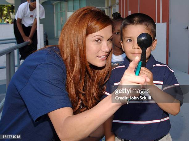 Danneel Harris performing Visual Acuity test with participant