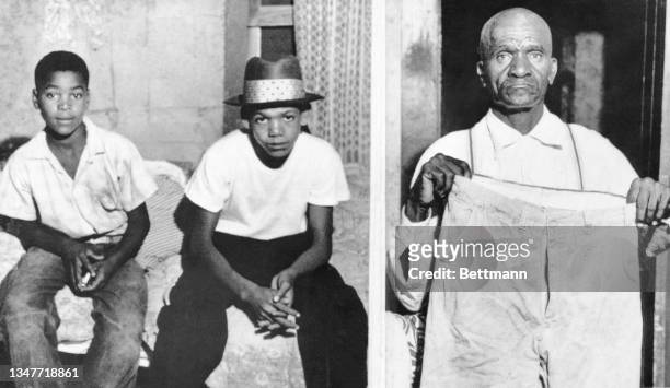 Simeon and Maurice Wright cousins of the murdered Black boy, Emmett Till, sit in their home after being questioned. The boys and their father Moses...