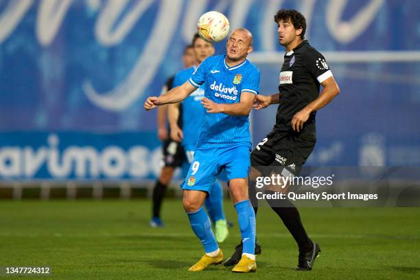 Roman Zozulya of CF Fuenlabrada battle for the ball with Mikel San Jose of SD Amorebieta during the LaLiga Smartbank match between CF Fuenlabrada and...