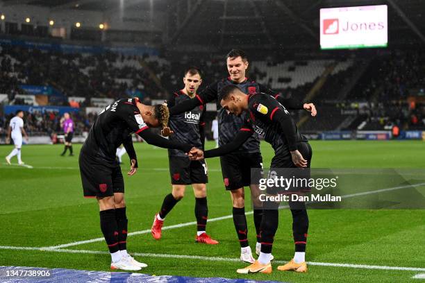 Karlan Grant of West Bromwich Albion celebrates with teammate Callum Robinsonafter scoring their side's first goal during the Sky Bet Championship...