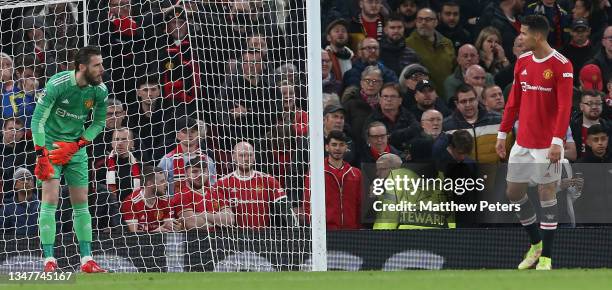 David de Gea and Cristiano Ronaldo of Manchester United react to conceding a goal to Merih Demiral of Atalanta during the UEFA Champions League group...